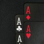 black playing cards, four aces and black background